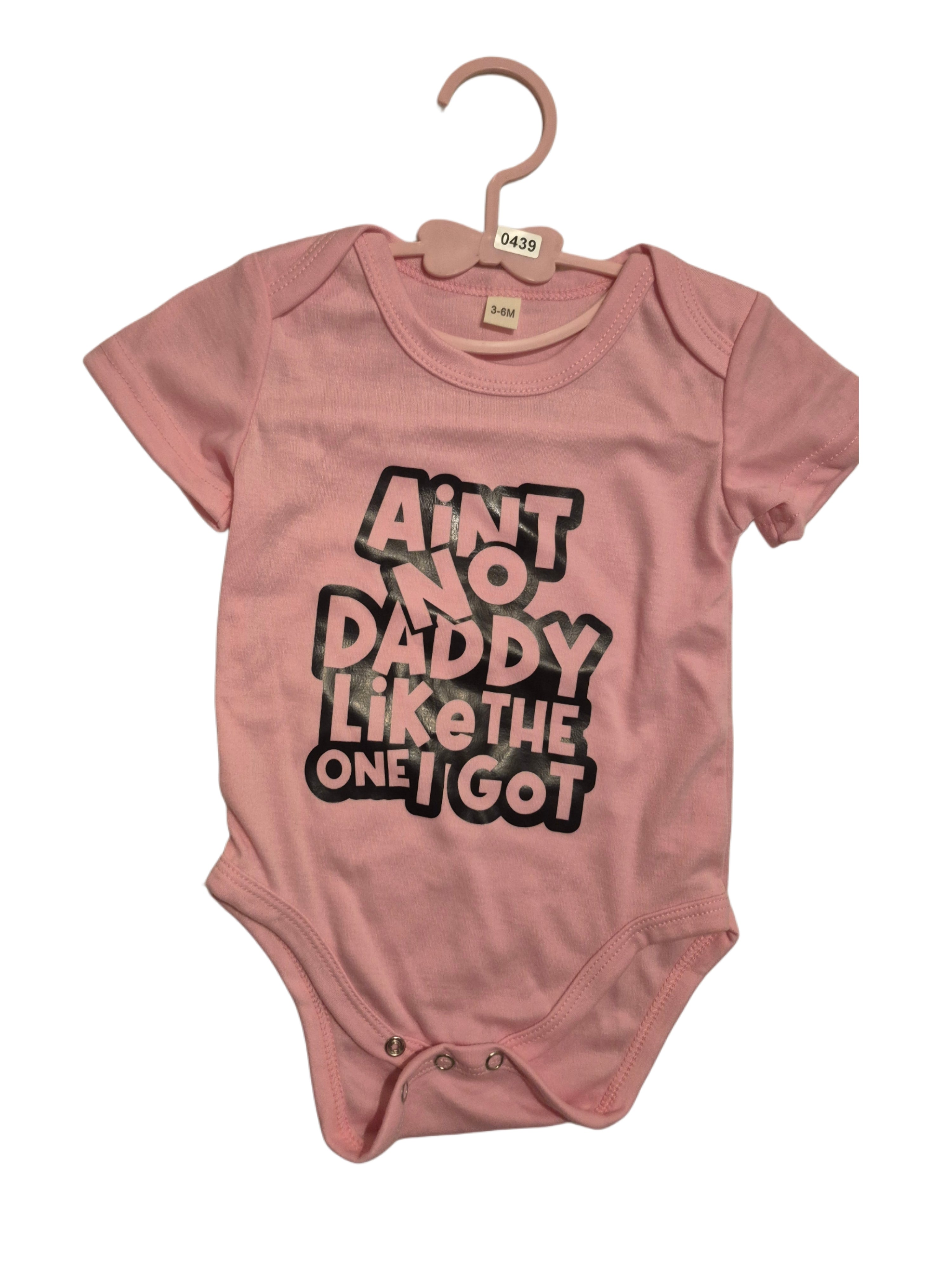 Baby girl, short sleeve onesie “ain’t no daddy like the one I got”